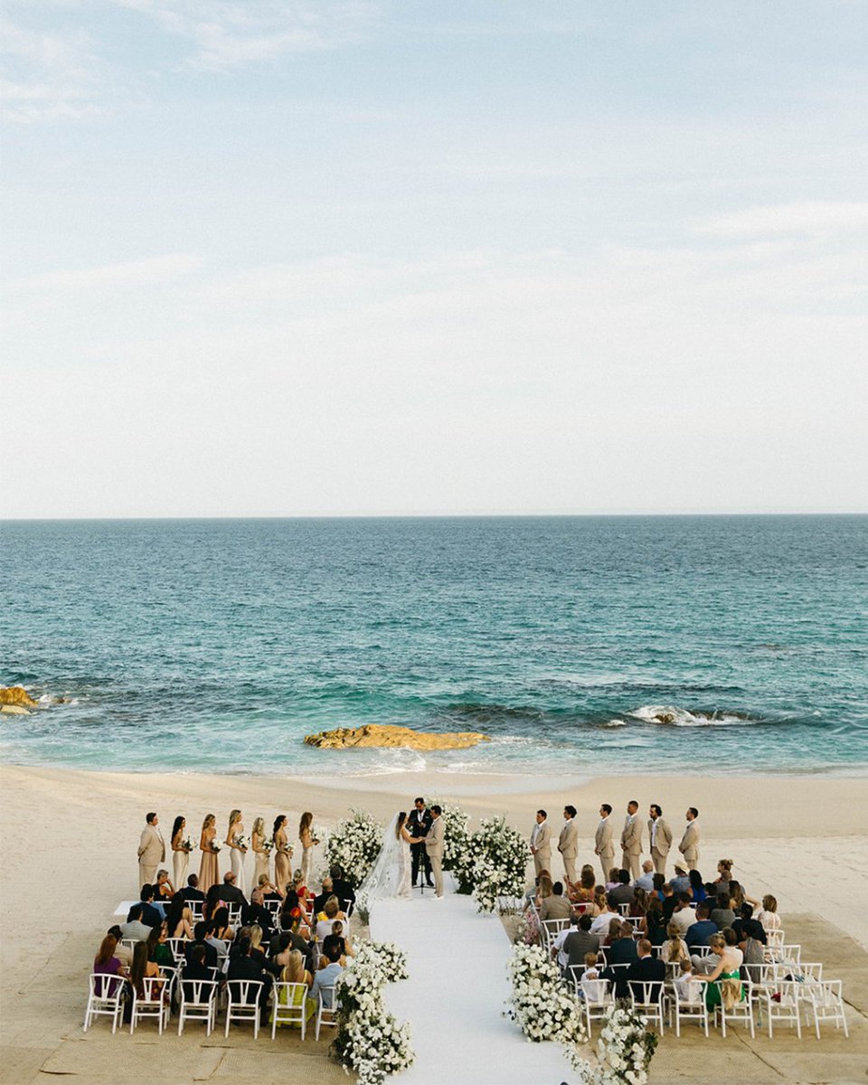 In the gentle embrace of sunlight amidst all-white wedding details, love silently inscribes its lyrics on the pages of their hearts—Sterling &amp; Parker, 07.10.23, where purity met passion. #loscaboswedding
