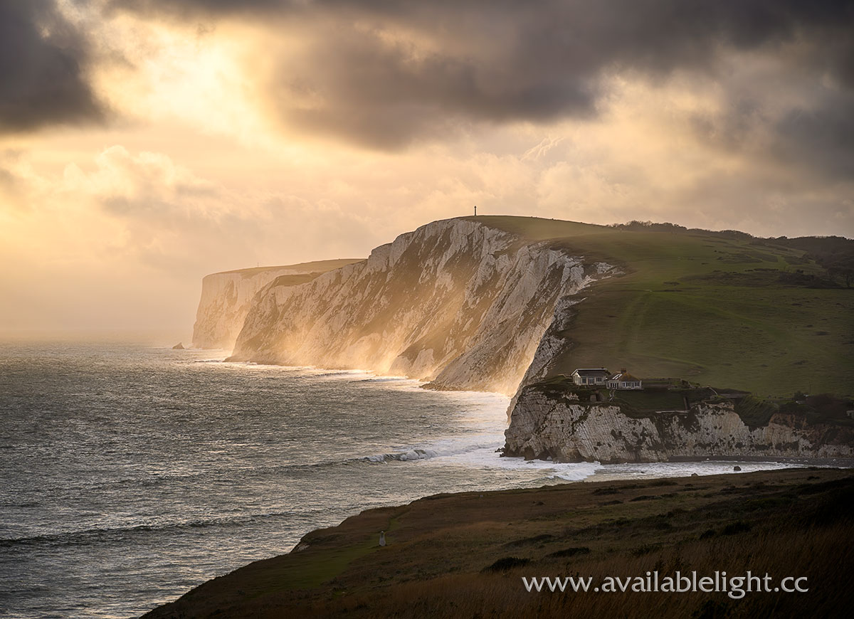 Autumnal rays of sunlight breaking through the stormy skies at Tennyson Down.
