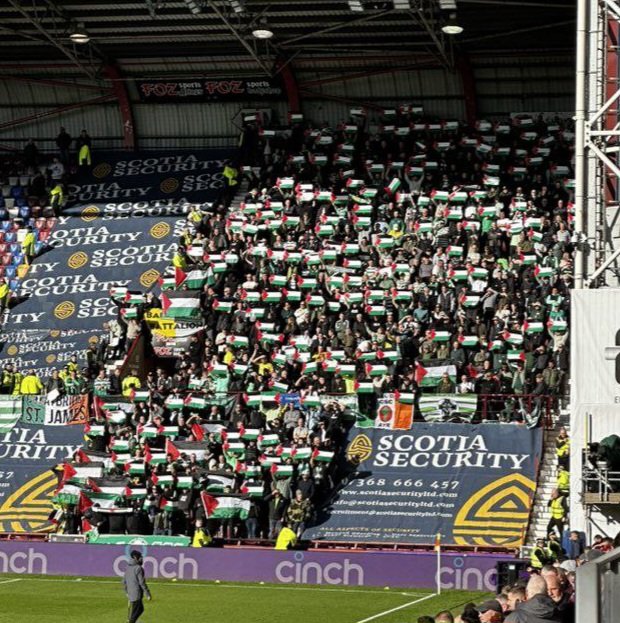 Scottish football fans fly flag of Palestine in match against