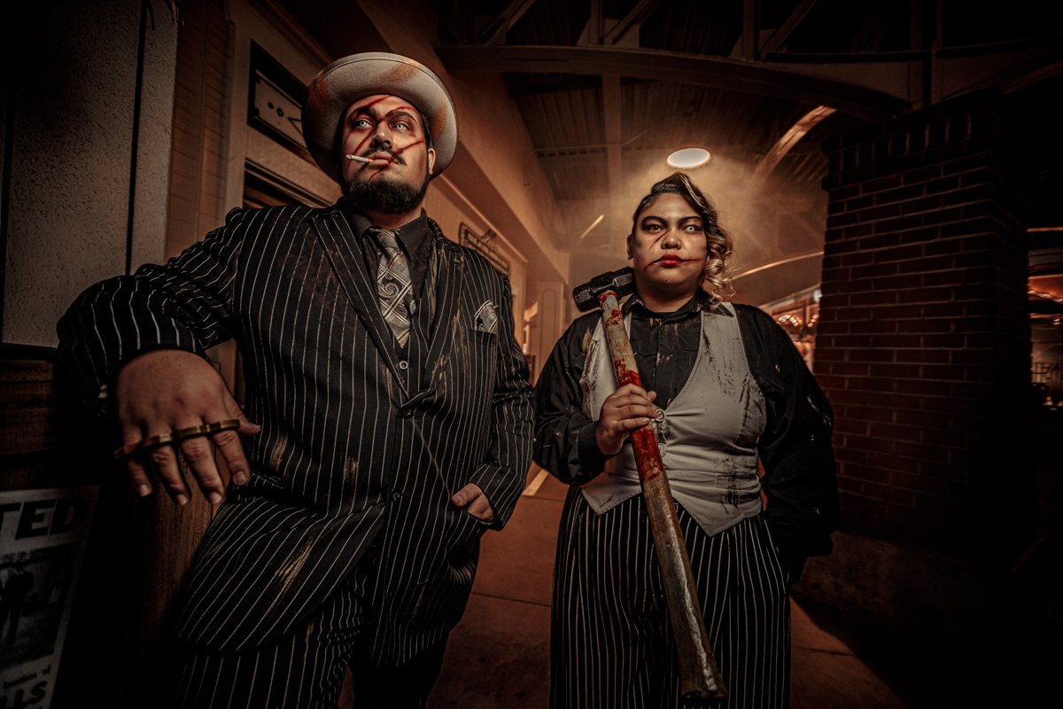 Beware the gangsters peddling forbidden spirits. Locals say their Devil's Elixir is a real killer drink, if you catch their drift. Grab your tickets and avoid their gaze as you stroll down Memory Lane in the Gore-ing '20s Scare Zone. - bit.ly/3QrmlXV