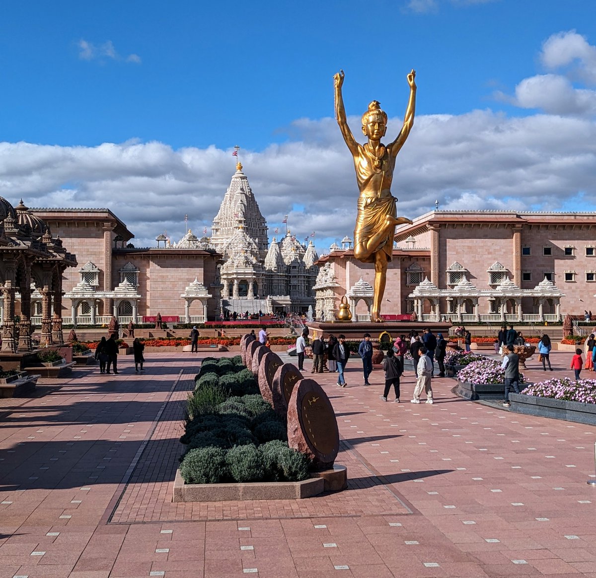 anthonypica's tweet photo. Amazing, beautiful, peaceful, respectful temple.

Good vibes from the start: the security guard at the vehicle entrance greeted me with a "good morning have a great day bro", a head nod, and a smile.

The campus was immaculate.

For the first time in awhile, I wasn't the first to initiate a smile.

There was an air of respect that I wish could be found everywhere.

The architecture was truly out of this world. I appreciatively took photos in the areas where photography was permitted.

After choosing to watch a 10-min orientation video in a small, comfortable theatre room—briefly learning the history of Swaminarayan Akshardham—I headed outside, under a slightly overcast sky.

A feeling of connectedness crept up on me.

A large family thanked me for taking their photo.

Ready to enter the Mandir, I eagerly removed my shoes.

As if gazing up into the cosmos, I soaked in the magnificent sculptures and architecture. Photos not permitted inside; I focused my attention on the beauty, instilling the sense of awe into memory.

I walked alone but the feeling of connectedness overcame me.

Beautiful silence inside the Mandir created space for peace and gratitude.

A silence I will need to revisit.

Finishing my short trip, I went to the souvenir shop. Bought a blue cap with the Mandir's design on it. Regretfully didn't buy the statue of humility that for some reason reminded me of myself (I'll have to revisit and purchase it). I entered the café and enjoyed Indian cuisine.

Walked slowly back to my car, already thinking about my next visit.

There are scheduled ceremonies open to grateful guests like me to observe. I will revisit.

“In the joy of others lies our own.”
— Pramukh Swami Maharaj