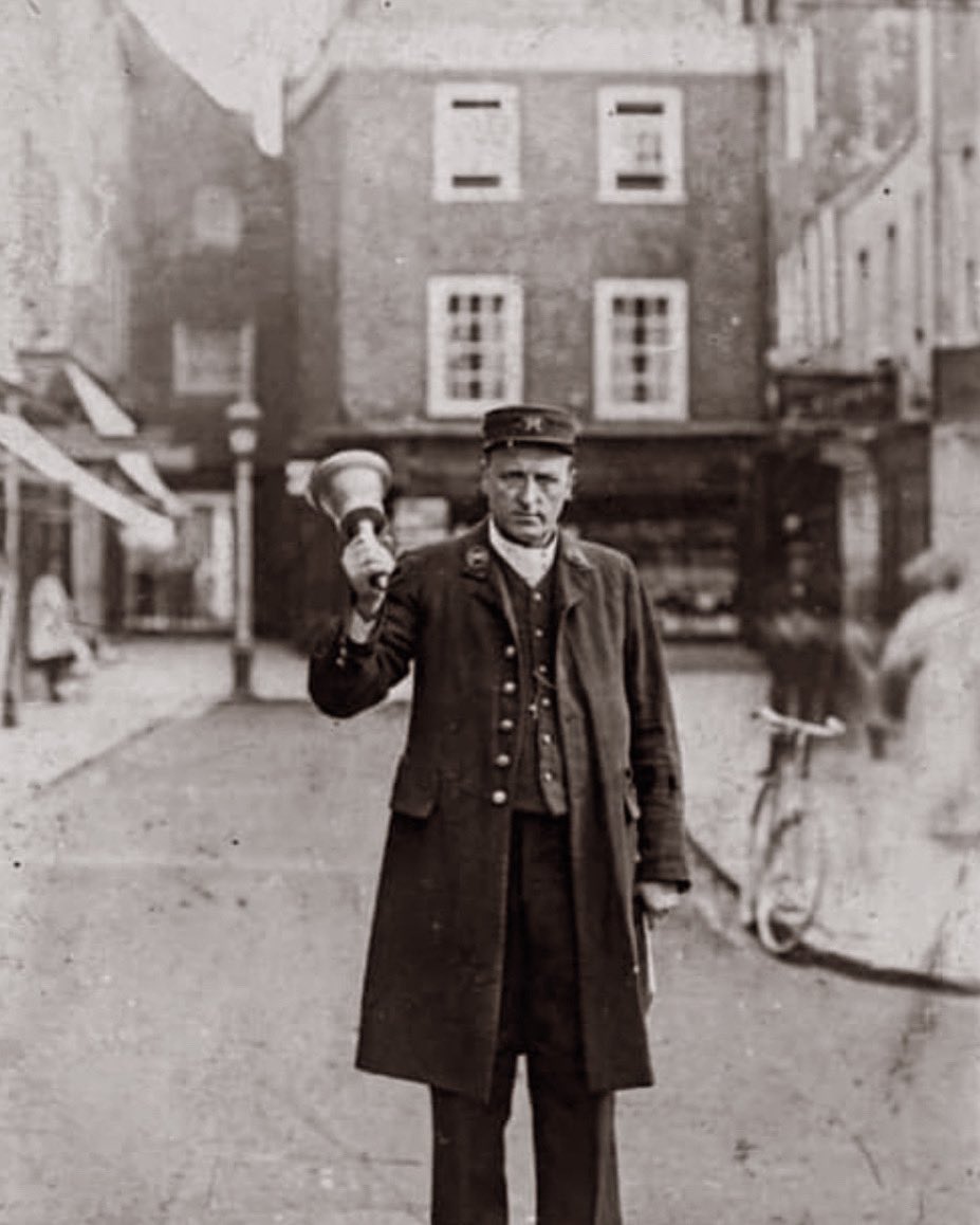 The town crier in The Square, Winchester. This photograph was taken in around 1910. If <a href="/WinchesterCity/">Winchester City Council</a> ever wish to appoint a Town Crier the Ancient &amp; Honourable Guild of Town Criers would be glad to assist.