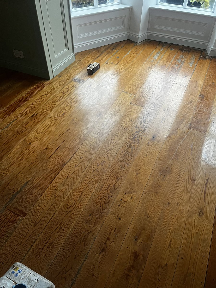 Floor restored - solid European oak floor sanded back to bare wood and given a bespoke finish using WOCA Denmark Brazil Brown master colour oil followed by Walnut master colour oil &amp; sealed with a 2K silk gloss lacquer from the master lacquer range #bespoke #cork #floorsanding