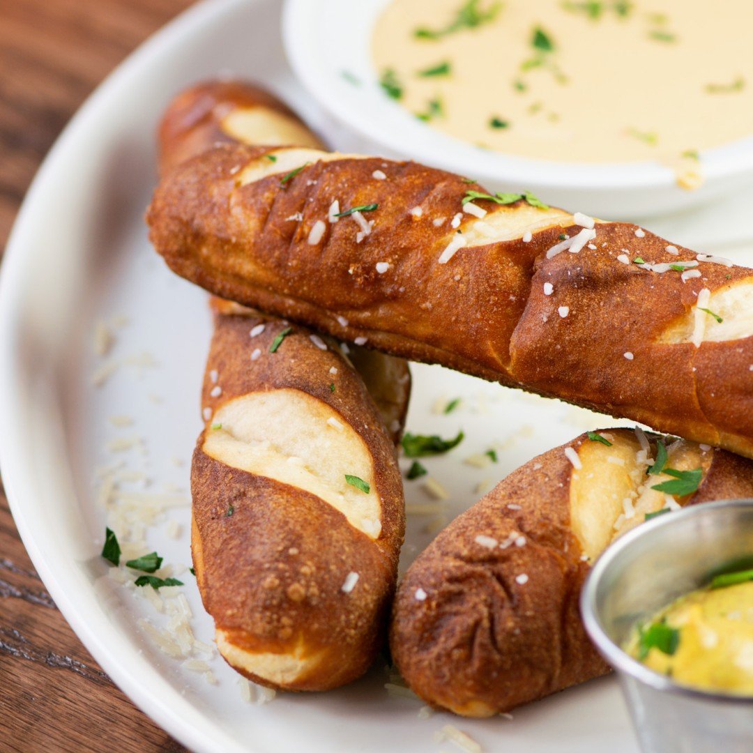 They say, "Never judge a book by its cover," but we say, "Never judge a Monday until you've had your Nom Noms." 🥨👀

Half off during Happy Hour, Monday through Friday, from 3-7pm in St. Pete &amp; Riverview. 😉