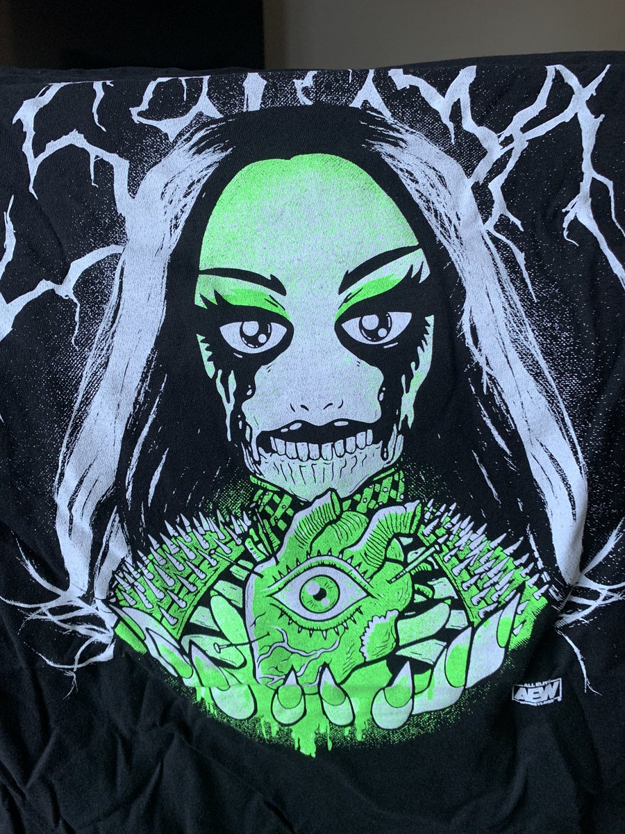 ZonkSays's tweet photo. Wow, the #AllEliteCrate was pretty great this time around. That color pops on the Acclaimed shirt. My wife is probably stealing the Saraya shirt, we love her. Unexpected dvd as well. https://t.co/PWArj3uxRD