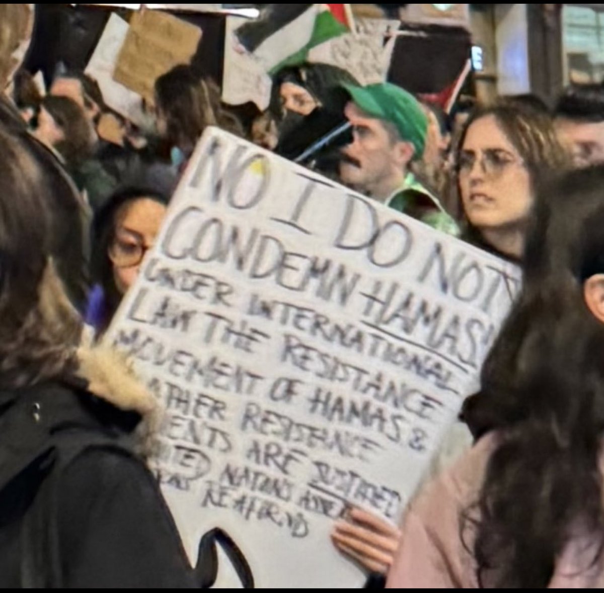 During a DSA rally, a participant holds up a sign calling Hamas a “resistance movement” justified under international law. First, Hamas is not a resistance movement. It is a terrorist organization. Second, there is no “resistance” exception to the rule against murdering