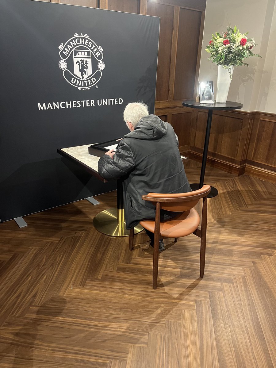 My dad signing the condolence book today for his team mate and friend sir robert