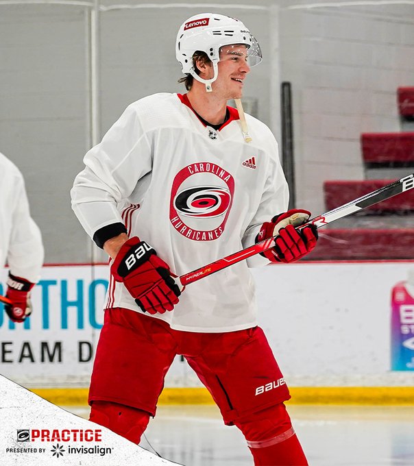 Photo of Andrei Svechnikov in a white Canes practice jersey