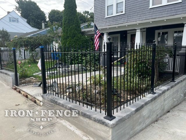 Our 3-foot iron fencing gracefully complements this elegant stone wall, adding not just height, but character to this charming house. Discover how our iron fences can elevate your home's aesthetic while ensuring security. 

#IronFenceShop #CurbAppeal #IronFencing #Elegance