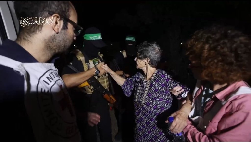 Israelis are going ballistic over this photo of Israeli elderly woman being freed by Hamas shaking his hand