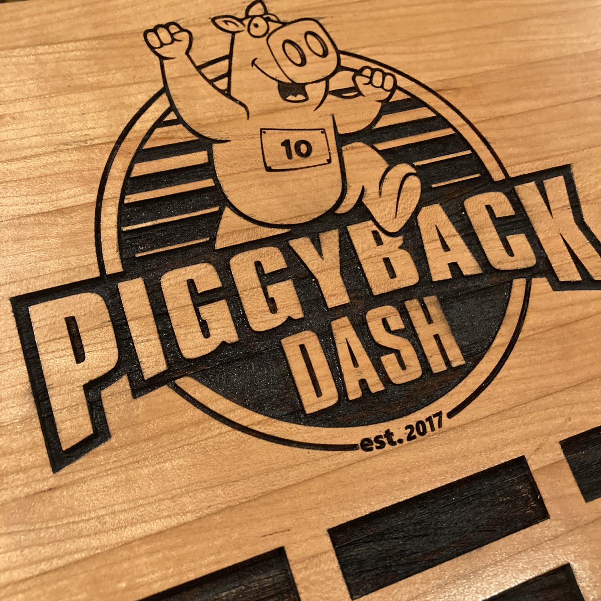 PiggybackDash's tweet photo. It’s #medalmonday and we wanted to thank Fenrir Woodworks for their awesome craftsmanship on our traveling award for “Best” Group/Team. Congrats to Ryse Up Bungee for being the first team to win it. #butcherblock #woodworking #plaque #unionmo #autumnhill #scholarship #runpbd https://t.co/NnIx07Cb38