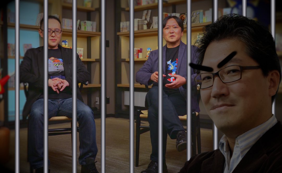 Yuji Naka watches from behind the bars of his prison cell as Iizuka and Oshima collaborate to create a new classic Sonic game together. He slams his hand against the bars and whispers, 'It should have been me.... IT SHOULD HAVE BEEN ME.....'