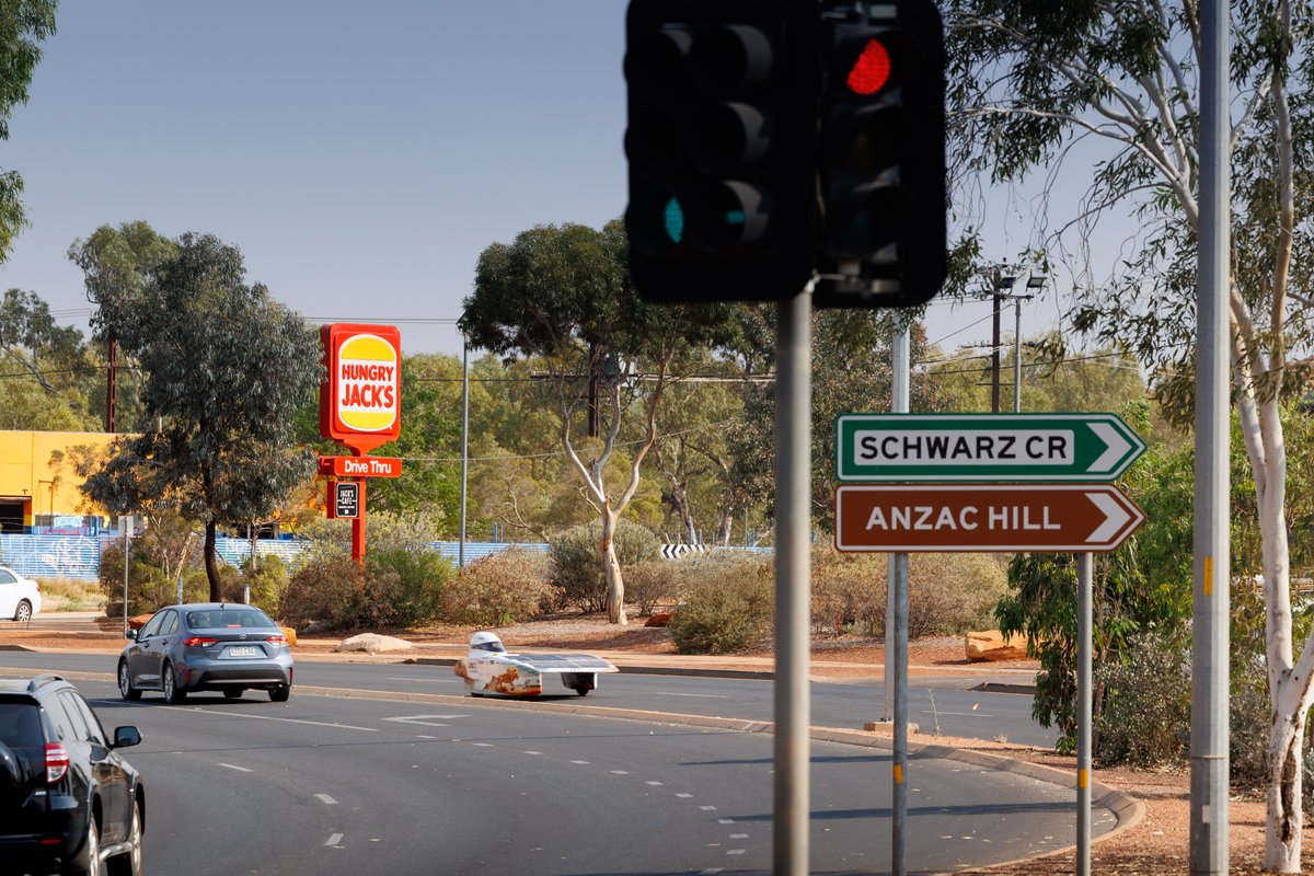 Nuna 12 just passed through Alice Springs for the first control stop of the day. This is quite a large town, and a big change in scenery compared to the outback where we could go miles without seeing other cars! #BWSC2023 #BrunelSolarTeam #Nuna12 #pushinglimits📸@Lightatwork