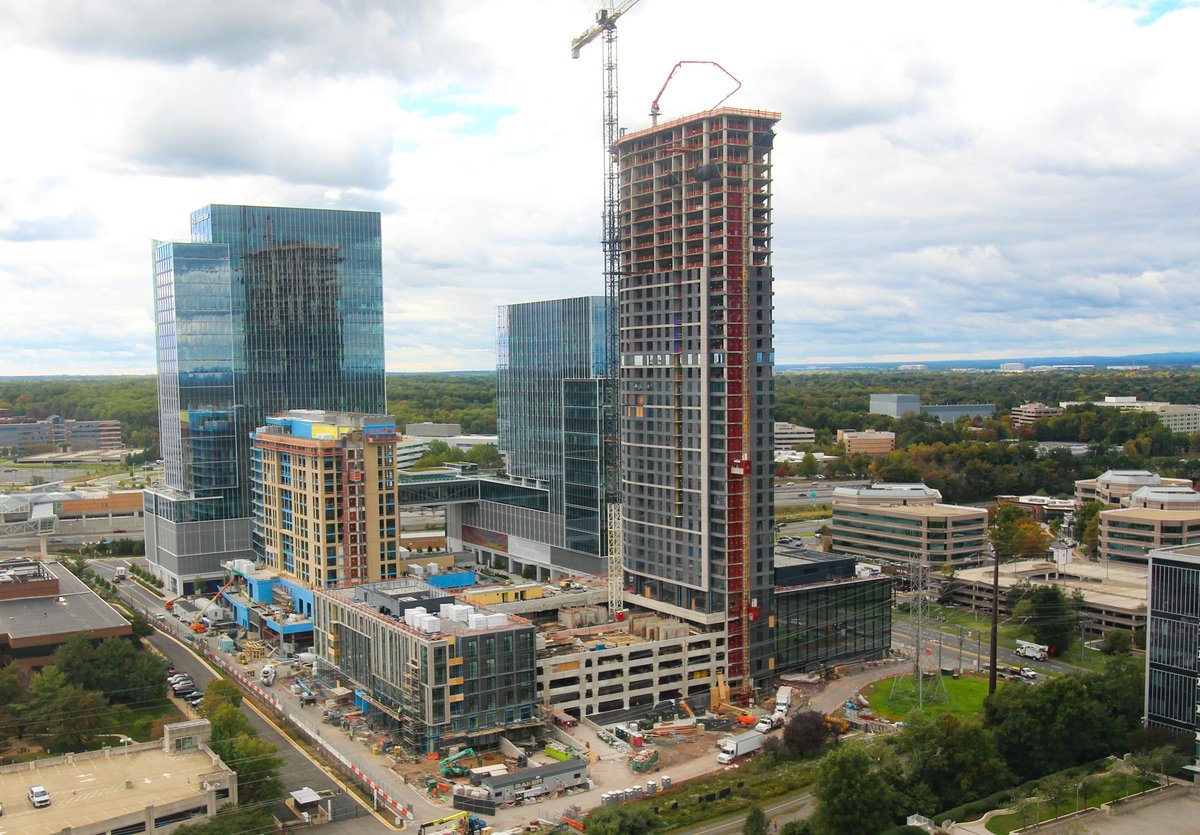 ClarkBuilds's tweet photo. Skymark Tops Out as Tallest Residential Tower in Capital Region! 🏗️ 

Clark joined representatives from @bxpboston and the talented craft workers on site to celebrate the completion of pouring 46,000 cubic yards of concrete to build the 470 foot structure in Reston, VA.   

The 40-story mixed-use high-rise will include 508 units, 5 levels of above- and below-grade parking, and 80,000 square feet of office space. Skymark is Clark's third installation at Reston Town Center, and joins two completed office buildings on the campus. #ClarkBuildsVA