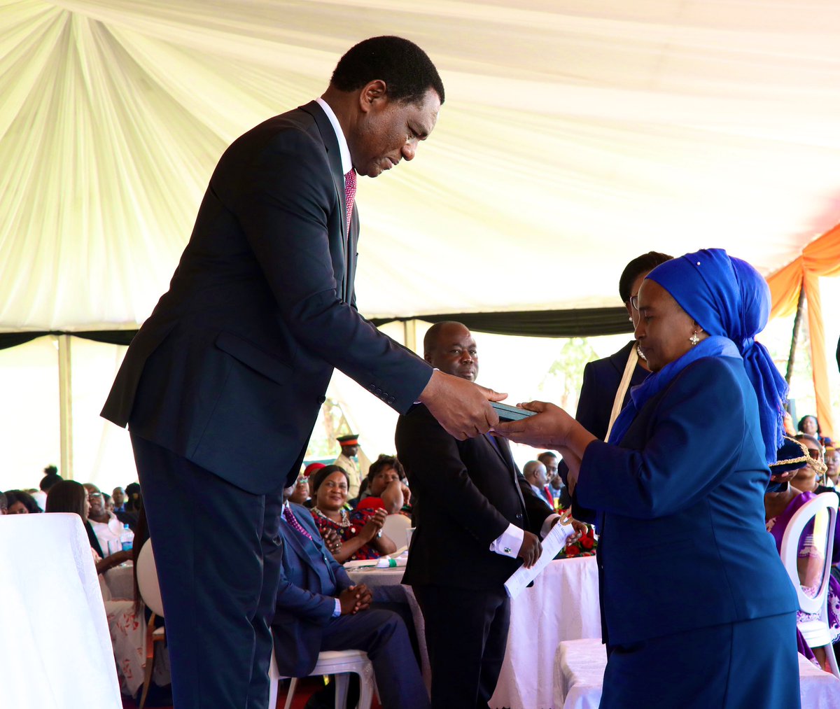 HHichilema's tweet photo. At the Investiture Ceremony today, gallant citizens were recognised with honors &amp; awards.
Notable among them, H.M Paramount Chief Mpezeni IV, bestowed Order of the Eagle of Zambia - 3rd Division, alongside many other heroic Zambians, both living &amp; posthumous.🇿🇲 #Zambia@59 https://t.co/YI1zoOwMr8