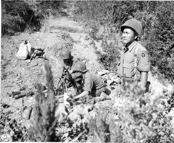 Japanese-American mortar crew of 100th Infantry Battalion, U.S. 442nd Regimental Combat Team, firing into suspected German sniper positions in the Montenero area, Italy, on August 7, 1944. #History #WWII