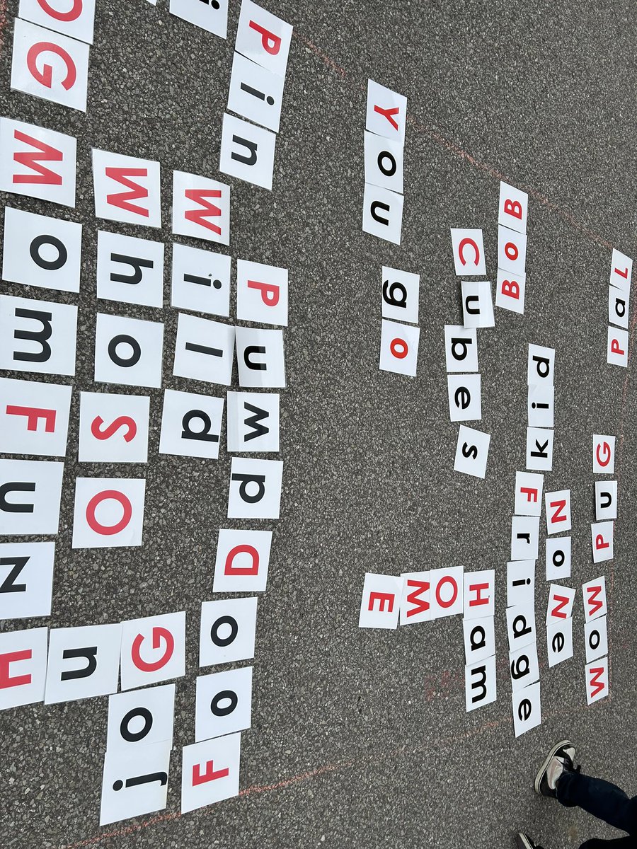 The grade 3s making words on the tarmac during Take Me Outside Day.