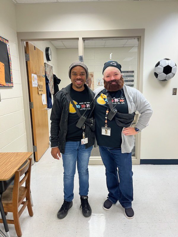 HeatherBrusso's tweet photo. When it’s twin day at your school you and your AP were going to wear the same outfit then you decide to fully commit to the character.  Laughs all around! My beard grew more. @PortCps @cpschoolsva @drjcotton https://t.co/pFtz1lxGA4