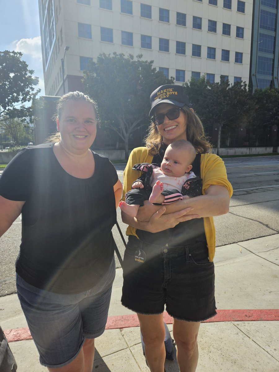 Had a great day with friends out on the picket line! Huge thanks to the amazing <a href="/AmyLandecker/">Amy Landecker</a>, for taking a photo with my friend's precious baby! One day longer, one day stronger. #SagAftraStrike #SagAftraStrong