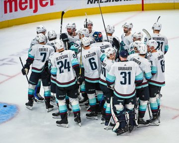 Photo of the team celebrating Eberle's OT goal on the ice