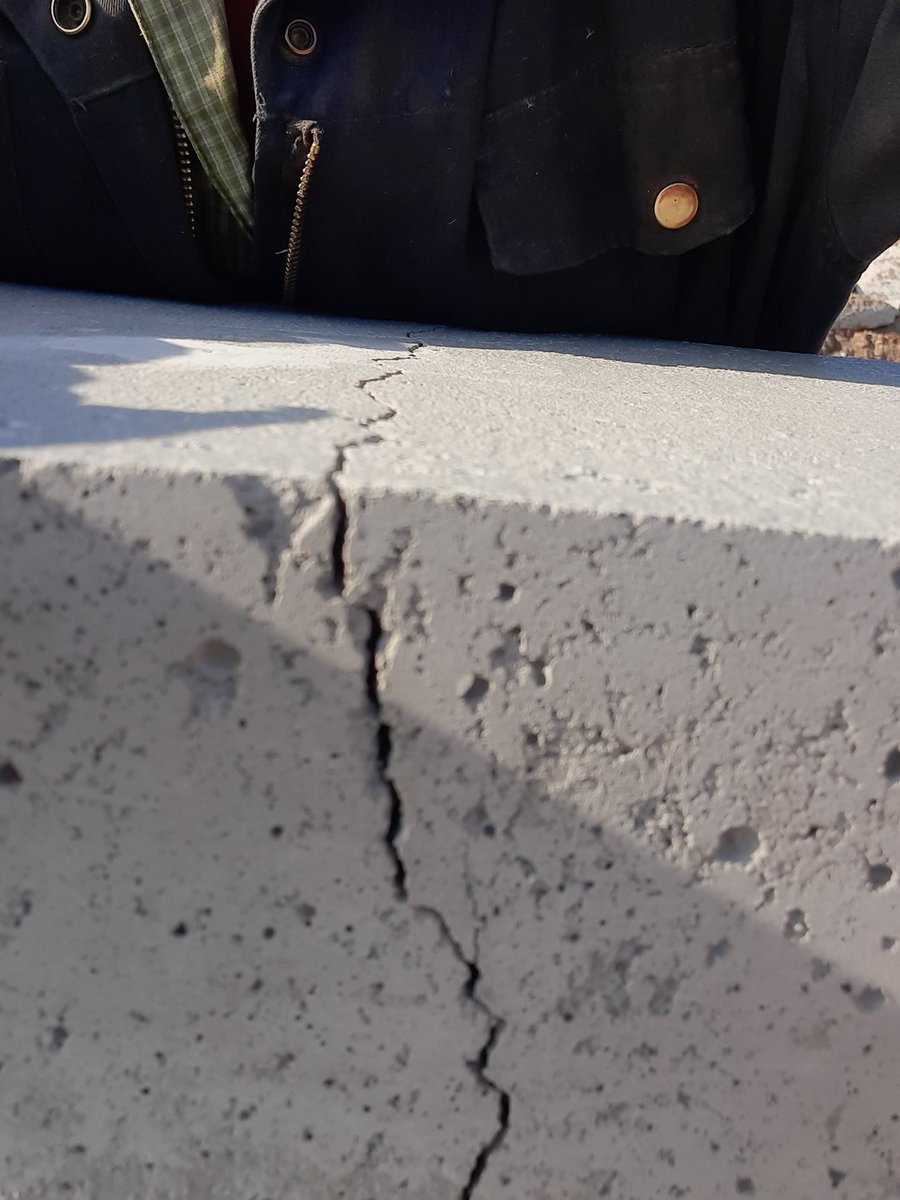 Have cracks in 30 day old manure pit walls. What's the best solution for fixing them ?