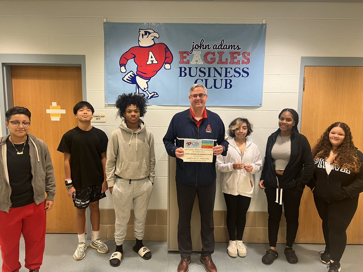 Some business students gathered this morning to wish Mr. Seitz a Happy National Principals Month with a sign &amp; Starbucks gift card!