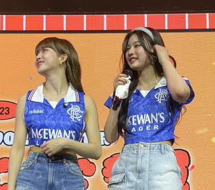 In Dallas, K-pop group STAYC wore Glasgow Rangers football shirts, instead of Texas Rangers baseball shirts – the mix-up also explains their new single, 'No Surrender To The IRA'
