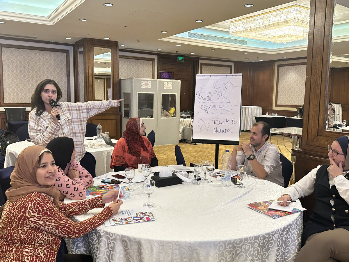 ScienceAlly's tweet photo. #SciCommEgypt participants drawing a picture of the what they imagine the country will look like if access to #GeneEditing is created for smallholder famers #BiotechRocks https://t.co/3diQR5VNgc