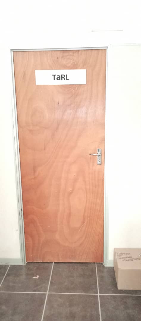 TshepiMatsheng's tweet image. This door looks not so interesting. But when government provides you an office within their offices, and puts a label on the door #TaRL, it's a HUGE deal. This is what we mean by government integration, working alongside - door2door with the Ministry of Education @youthimpactorg