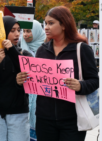 NYU confirms it is investigating two students who held up antisemitic signs at a protest in Washington Square Park today.