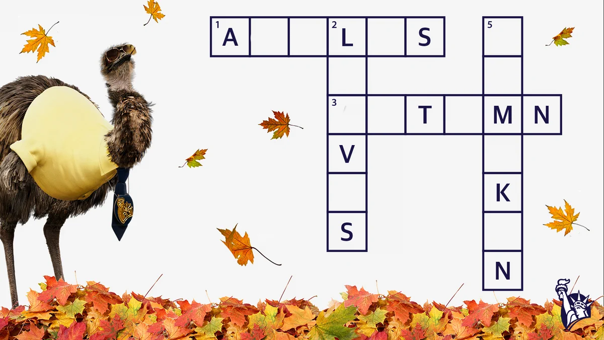 LiMu Emu is standing on a pile of fall leaves. To the right is a partially completed crossword puzzle of fall-themed words.