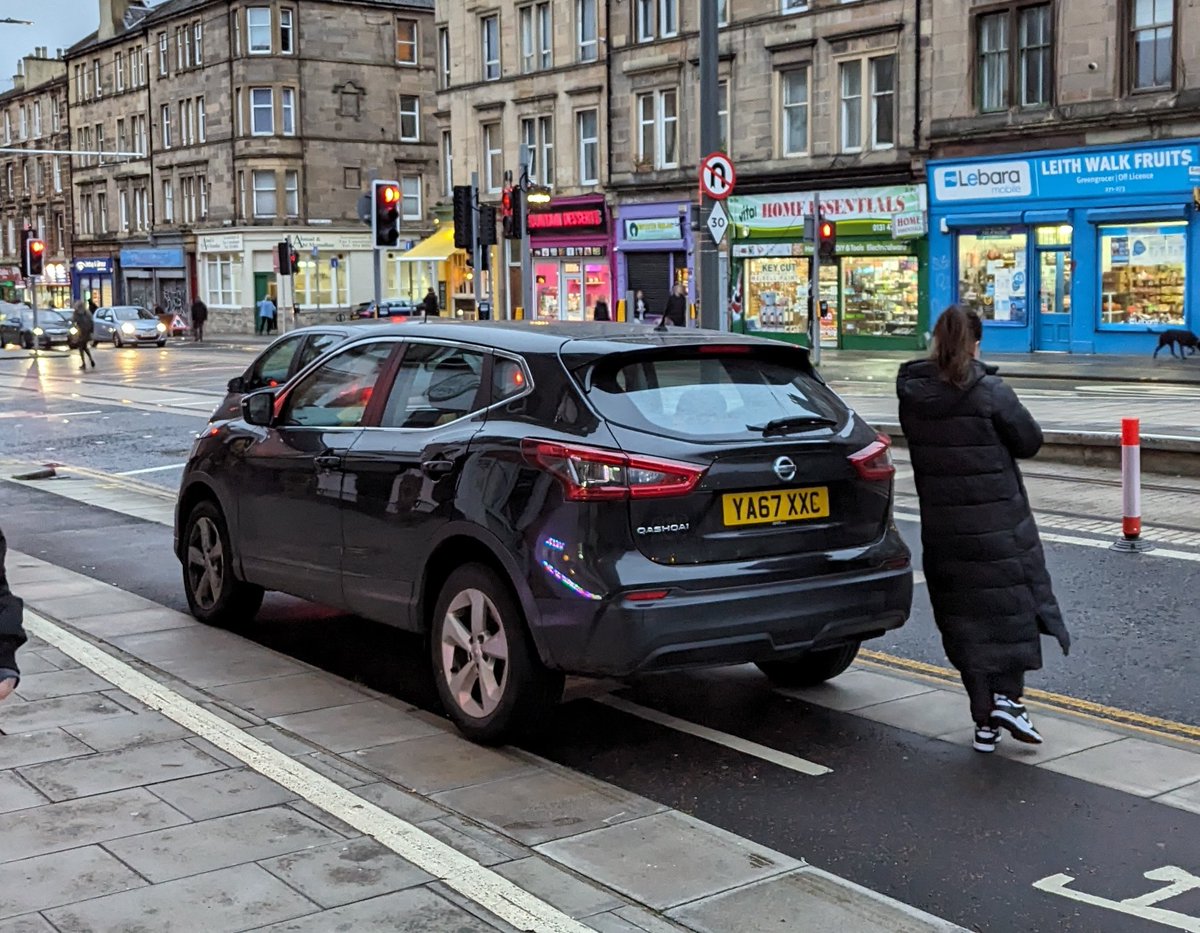 If she'd turned the car around she could have leaned out the driver window to the cash machine, saving herself that 3m walk.