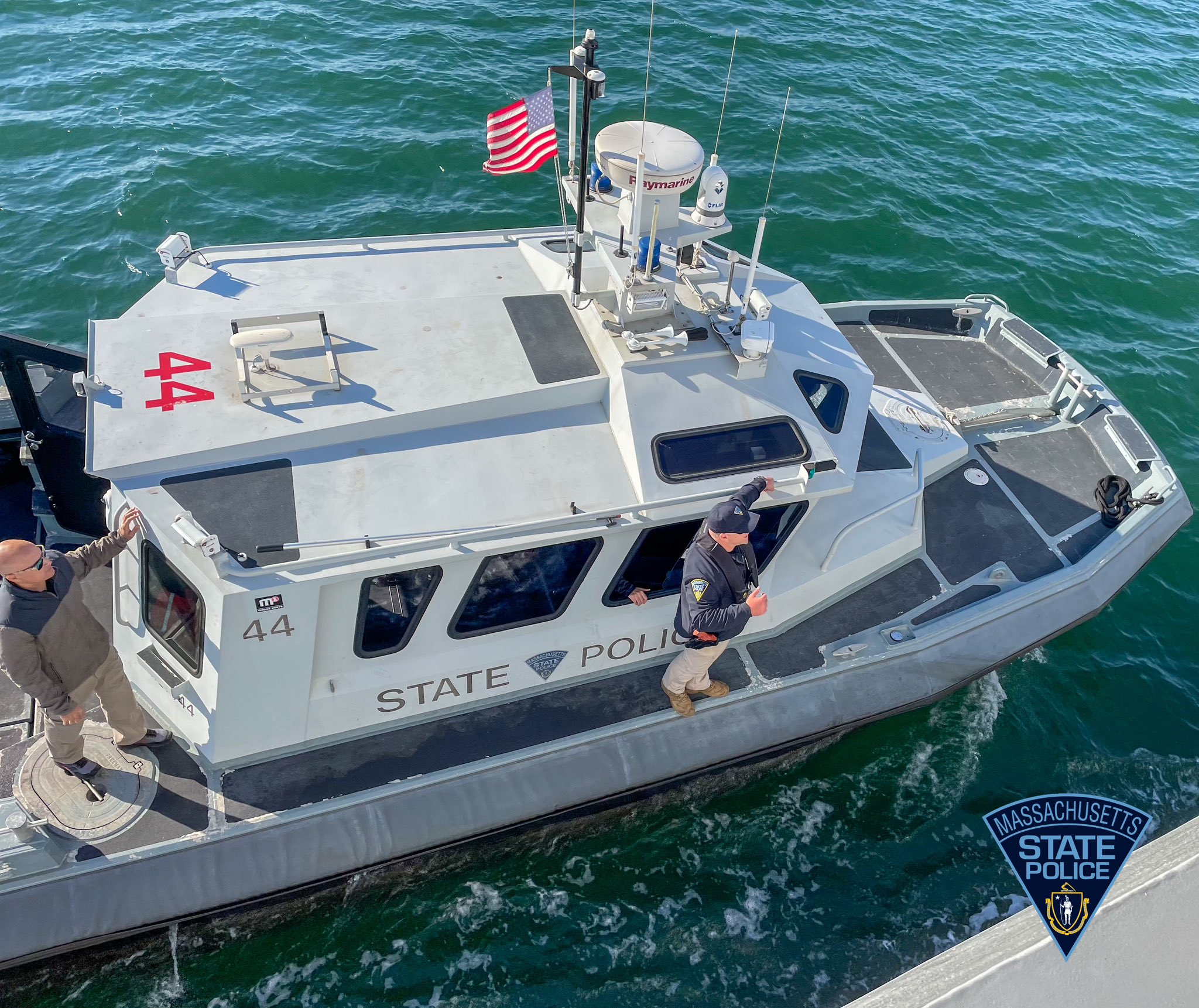 Trooper standing on a State Police boat.