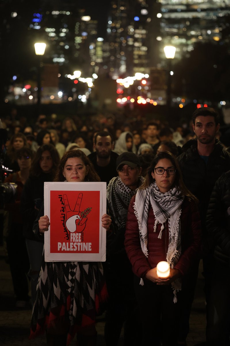 Hundreds gather in front of Queens Park in Toronto for a candlelight vigil to mourn over 6,500 Palestinians killed by the Israeli military & to demand an immediate end to the Israeli bombardment of Gaza.