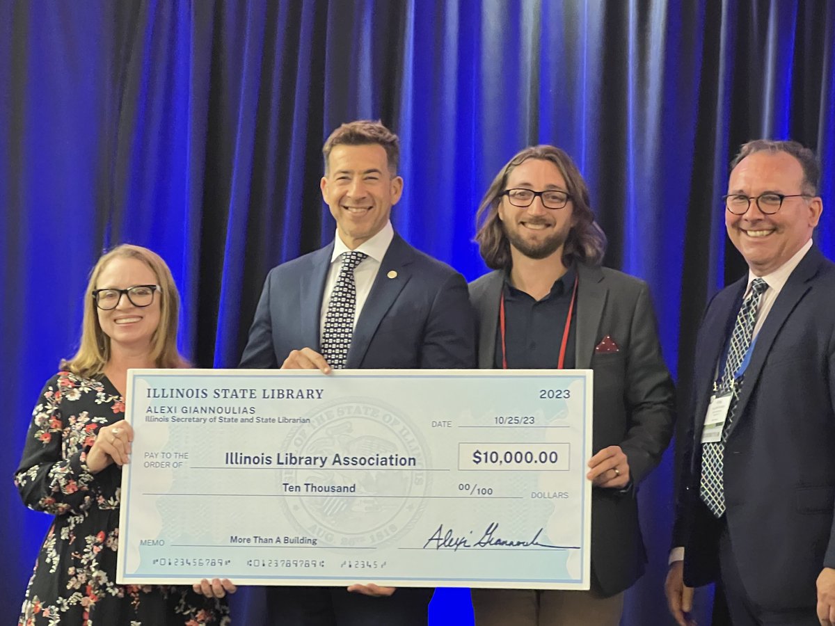 IllLibraryAssoc's tweet photo. At #ILAAC23 today, @ILSecOfState gave words of support to the Illinois library community and presented ILA with a donation to support an advocacy campaign ILA intends to spearhead for Illinois libraries. https://t.co/25iQBPAVck