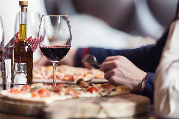 Have you ever tried wood-fired rustic Italian pizzas with a glass of wine? Describe the experience in one word!