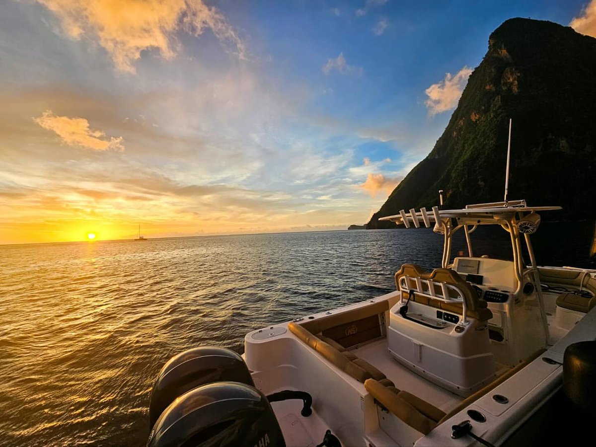 What an incredible sunset picture of the Pitons in St. Lucia by @synergymotoryacht. 

Explore the world's diverse cultures and landscapes with us. Learn more at hubs.ly/Q026Kqh40

#sunset #stlucia #pitons #caribbean #yachtcharter #poweryacht #explore #crewedyacht #vacations