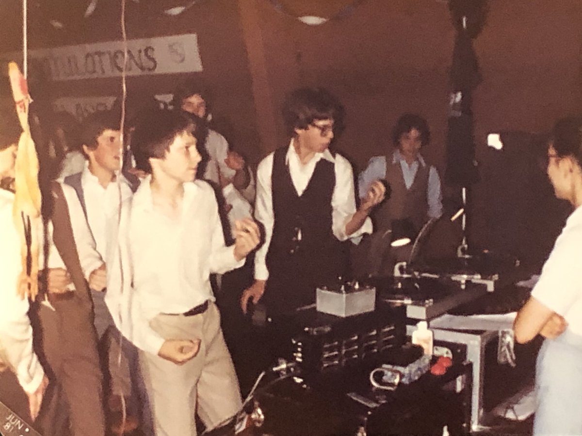 #TBThursday 1981 / DJ’ing 7th Grade “Paradise Theatre” School Dance for my brother’s class. @STYXtheBand My buddy Carl and I rocked the house! 🎧🎤 Note the air guitar-playing dudes in the ‘80s vests 🤘😎🤘 Also, can you find the rubber chicken?
