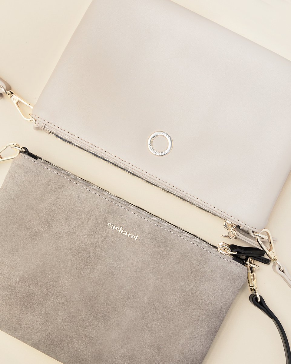 PLASTORIA's tweet photo. The Cacharel Alix showcases a unique design with two parts attached together, featuring natural light pink suede on one side and black on the other. This allows you to effortlessly match the bag with any outfit, making it a perfect accessory for every occasion.⁠ https://t.co/35vp3HsJJM