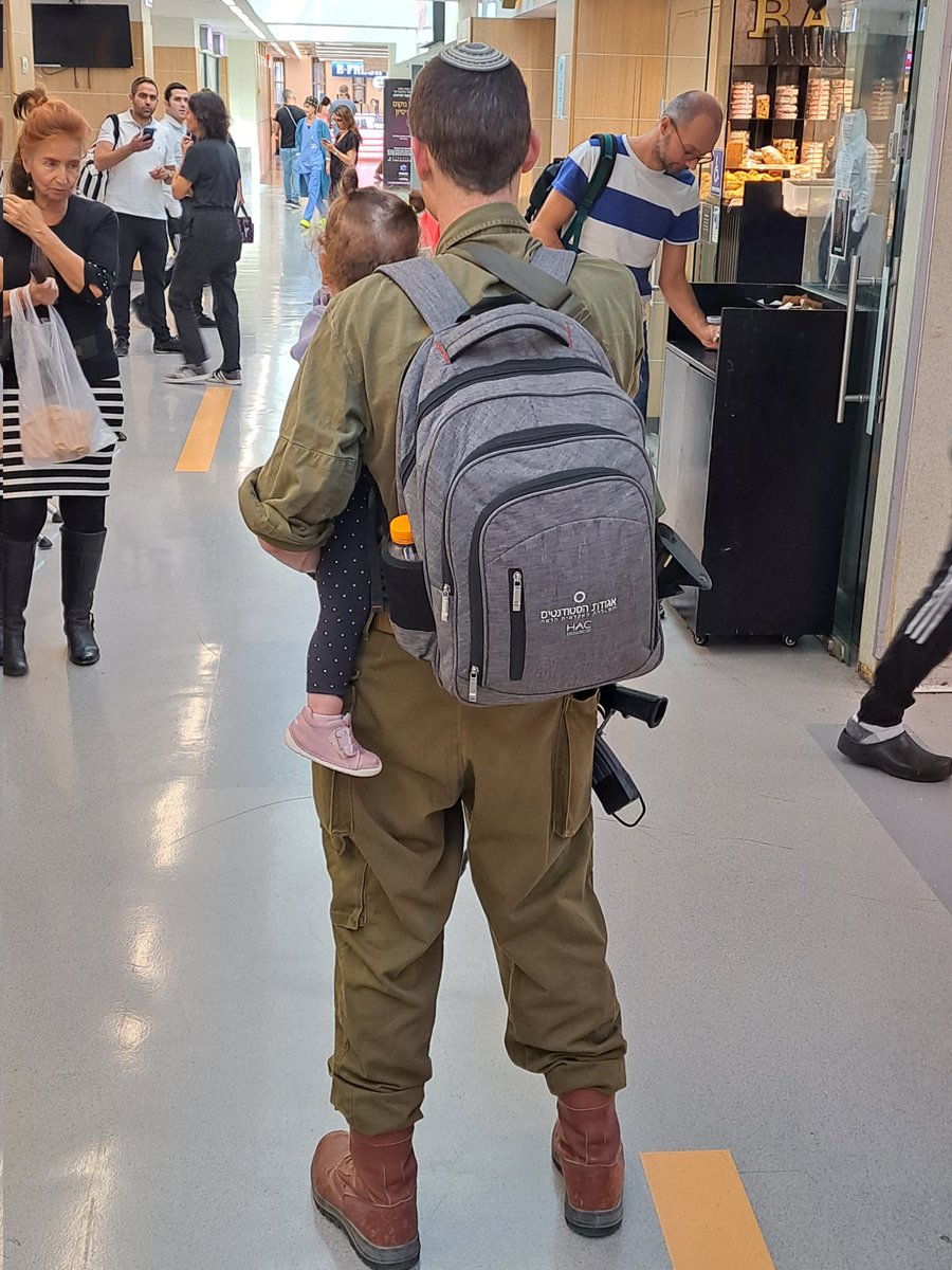 With a picture like that - an IDF soldier holding his baby - no enemy can beat us! Am Yisrael Chai! (This soldier gave me his permission beforehand).