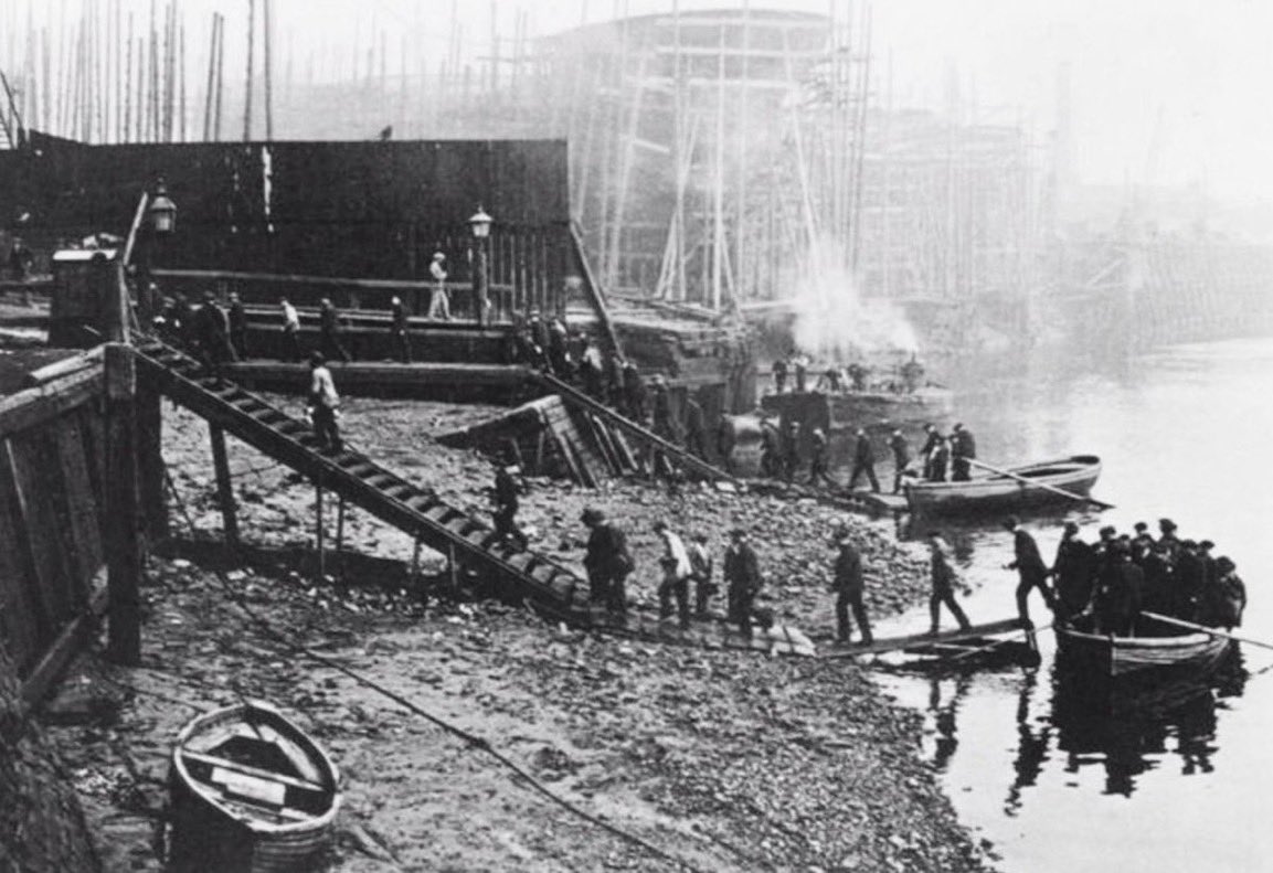 Workers alight from a passenger ferry on the shore of the Thames to begin a day at Thames Ironworks - this company’s football team became the nucleus for West Ham United FC - hence ‘the Hammers’ nickname and the crossed riveting hammers on their emblem… #Eastend #WHUFC