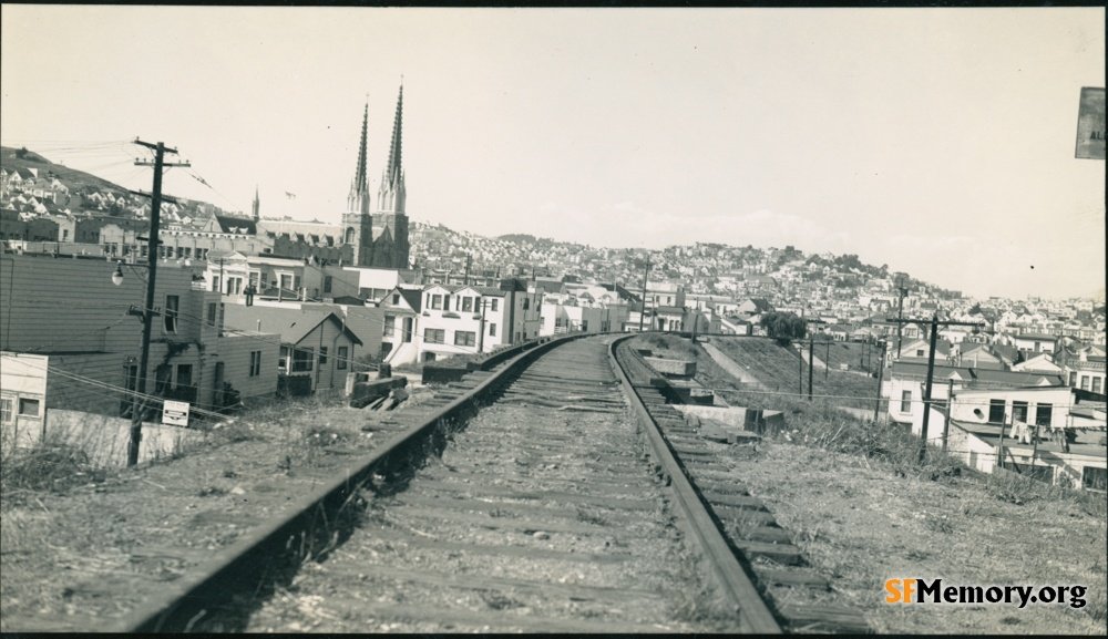 Noe Valley, 1942 
SFMemory:  Robert McFarland's 126 photos of SP's last days
Southern Pacific's Old Main Line was torn out in the early 1940s, starting with scrap metal drives to reuse the 7 railroad bridges between 27th &amp; 30th Streets. 
#sfhistory 
sfmemory.org/search/index.p…