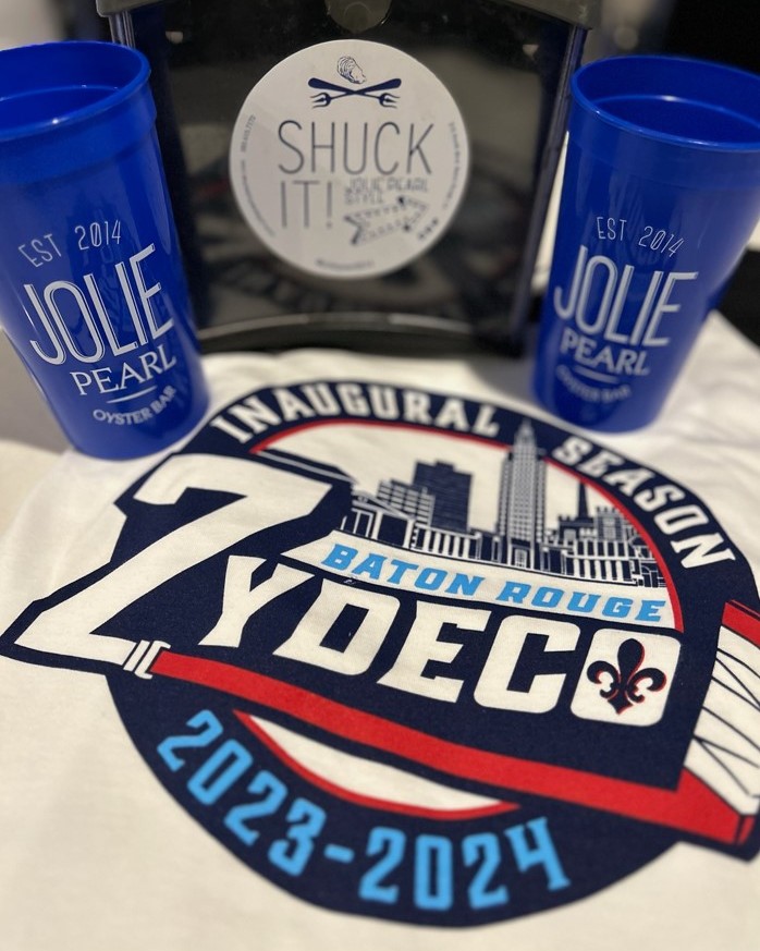 Join us and make Jolie Pearl a part of your Zydeco hockey game experience! Good food, great company, and unforgettable moments on and off the ice. 🏒  #downtownbatonrouge, #louisiana,  #joliepearl, #prettyshuckingood, #zydeco, #hockey