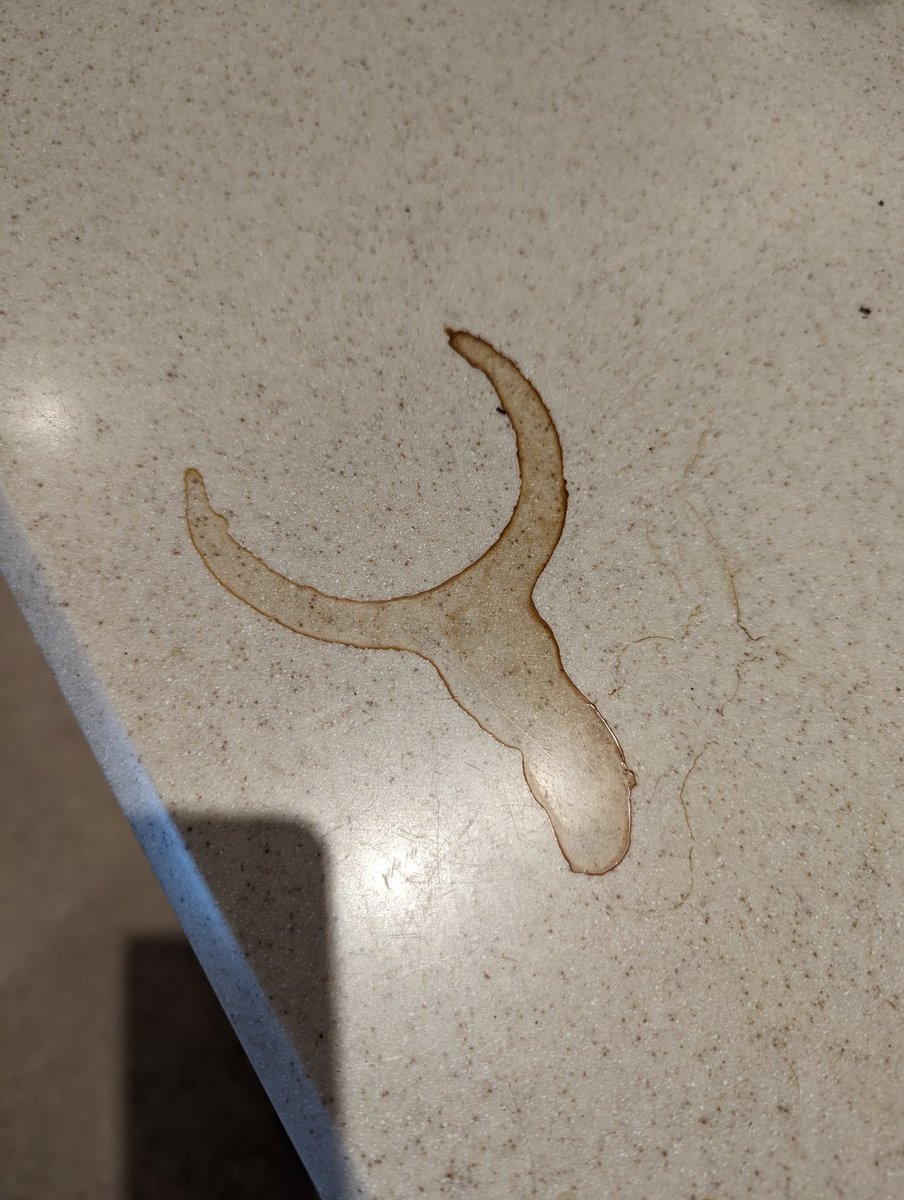 DUSKdev's tweet image. This coffee stain on my counter looks like the Quake logo