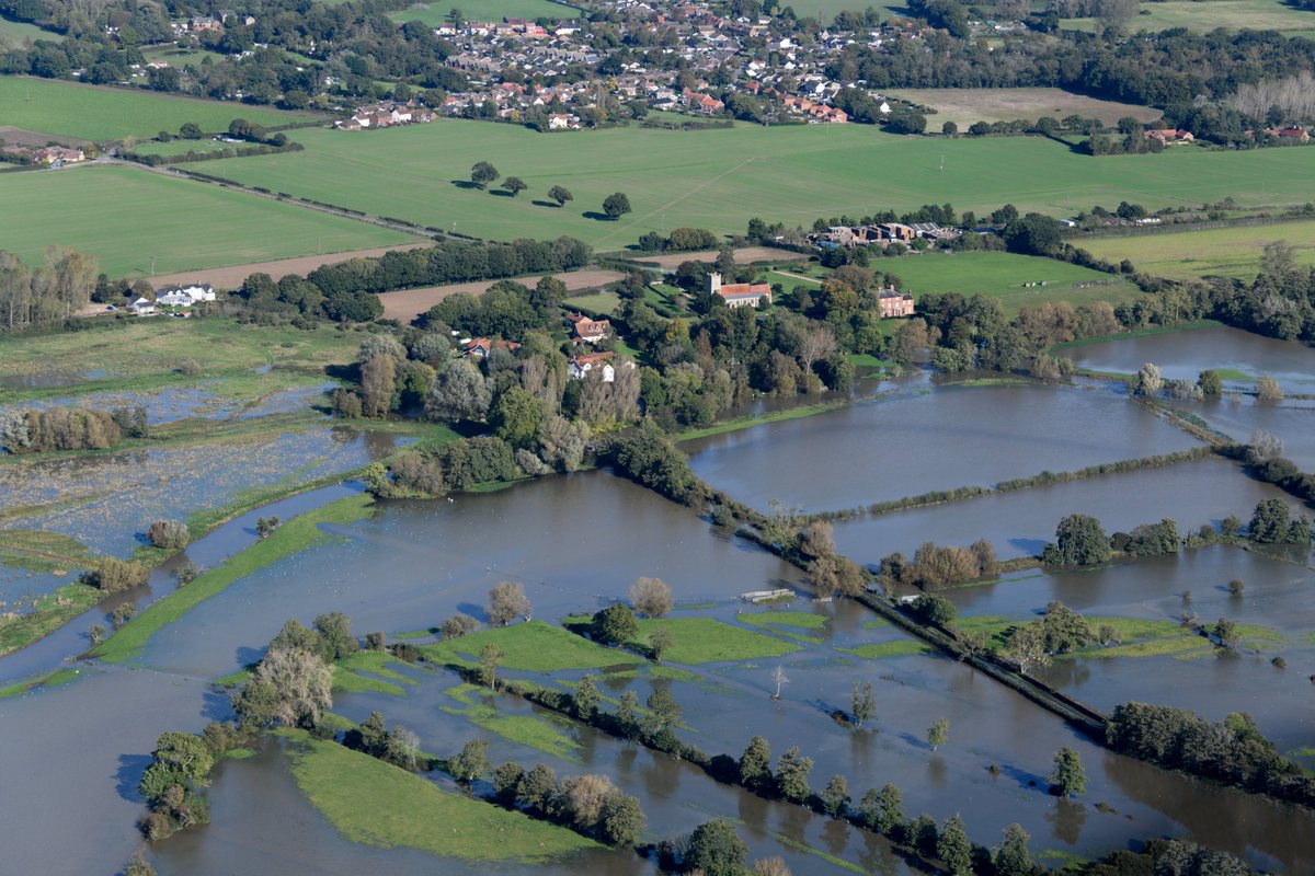 johnfielding001's tweet photo. Aerial image: St Mary's Church in Ellingham overlooking the flooded River Waveney valley in Norfolk. A result of Storm Babet #Ellingham #flooding #StormBabet #aerial #image #Norfolk https://t.co/rV6ZT7Nbav