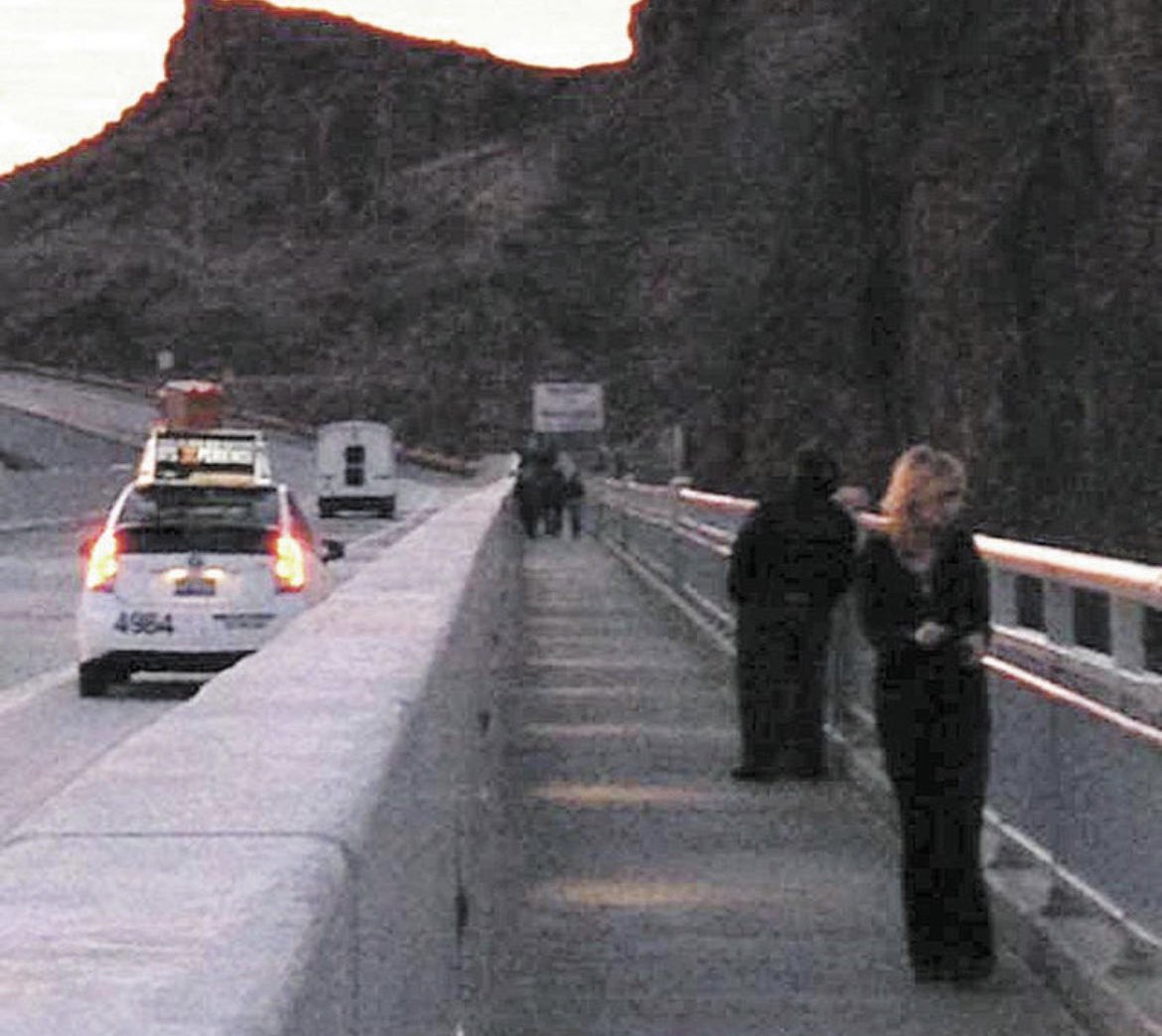 The last photo of Heather Price Papayoti shows her looking over the Hoover Dam bypass bridge on January 16, 2014. Just moments later, she jumped over the railing and ended her own life.