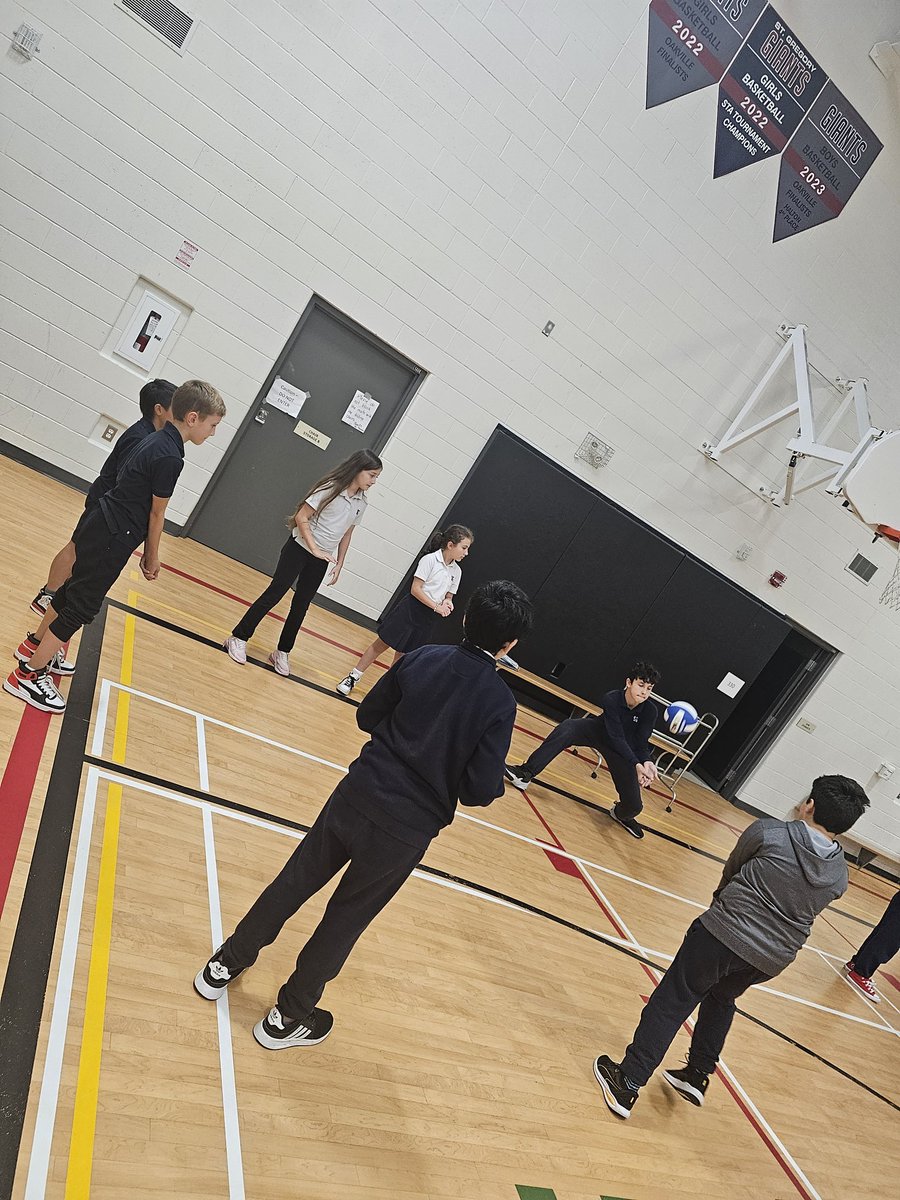 Since my dominant hand is currently in a cast, we were so lucky to have  some members of our boys' volleyball team join us for gym class today and tomorrow to help teach us how to properly hit &amp; serve a volleyball! #blessedwiththebest #thestgregoryway #proudcoach <a href="/StGregoryHCDSB/">St. Gregory</a>