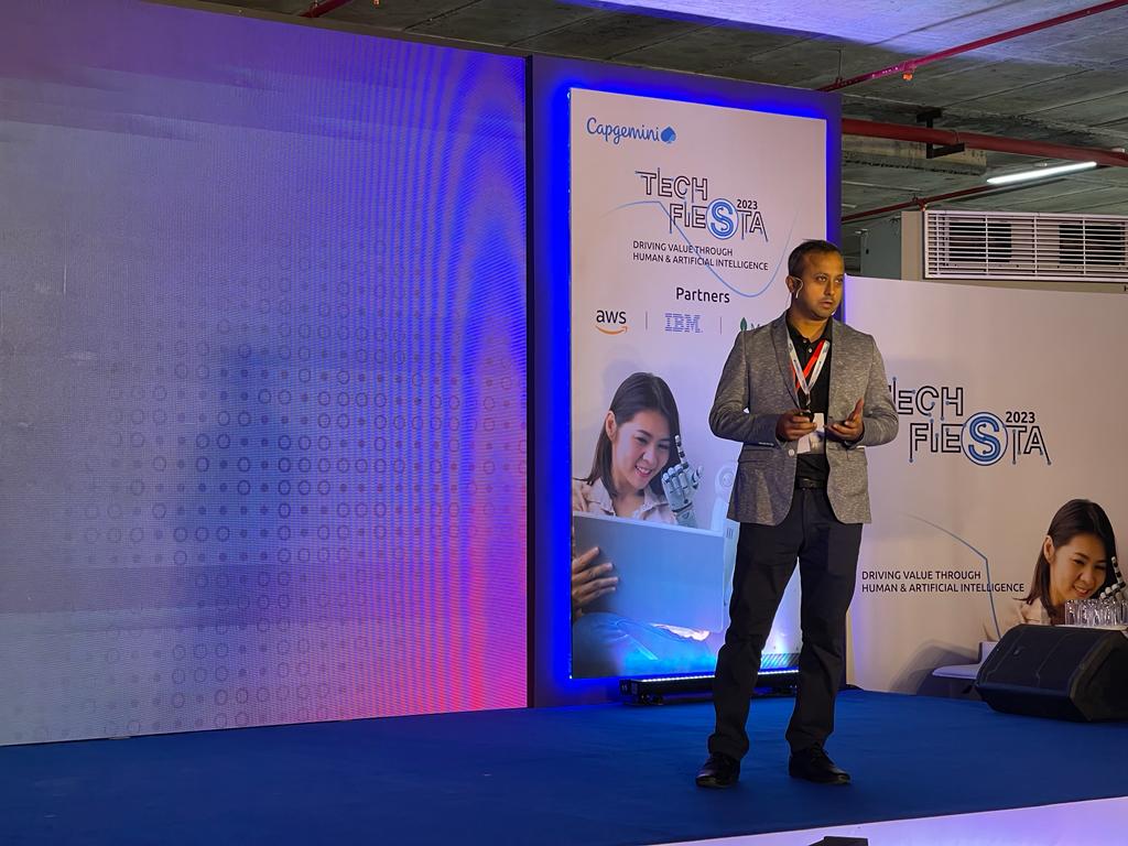 CapgeminiIndia's tweet photo. Speaking on the integration of generative AI into #Automotive manufacturing processes, Indranil Bhattacharjee, Senior Technology &amp; Solution Architect, AWS India, shares its data-driven results in product design &amp; quality, in-vehicle experiences, and more. #TechFiesta2023 https://t.co/FWu3RUaXzT