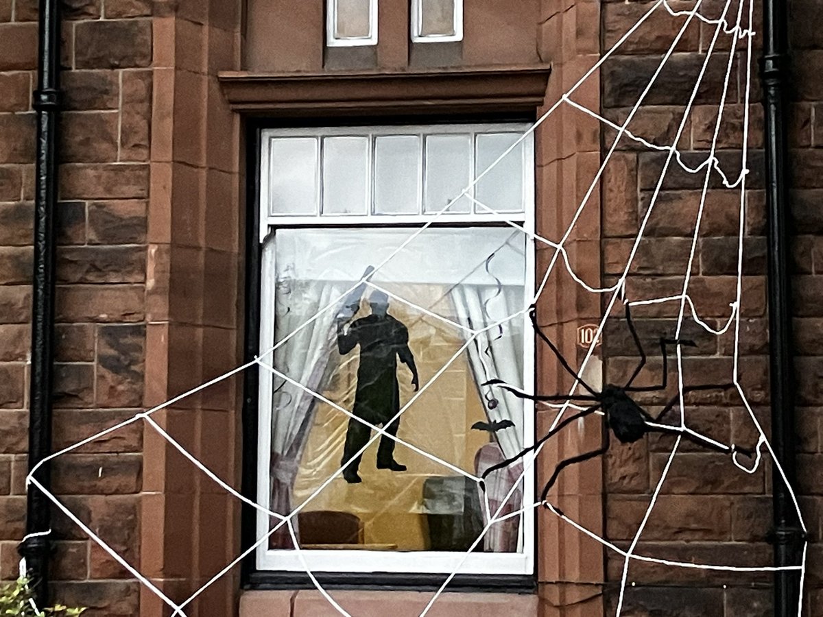 Morning! I’m a big fan of this image of a chainsaw wielding murderer that a care home in Cathcart have used in their Halloween decorations.