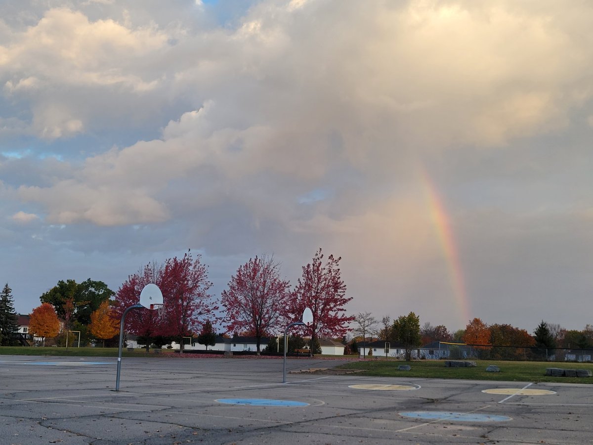 STCTimberwolves's tweet photo. What a beautiful rainbow over our school yard this morning! Shout out (up!) to Mrs. Ventura and Mrs. Freitas in heaven for brightening up this gloomy Friday morning and making way for some sunshine! 🌈💙💛 https://t.co/tSadZQ5FiV